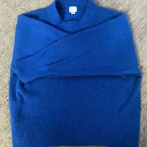 Worn a couple times, super soft and fuzzy!!